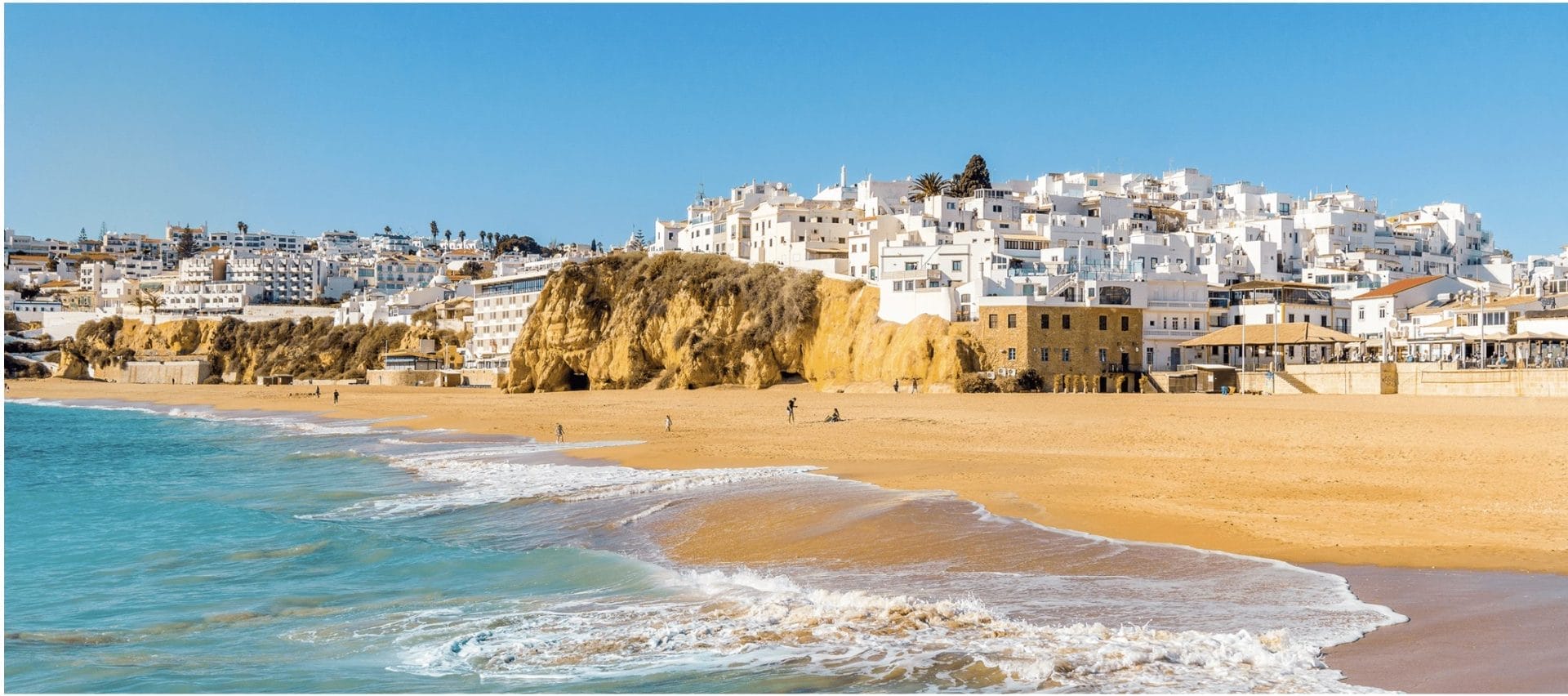 Albufeira's white town above a golden beach in the Algarve