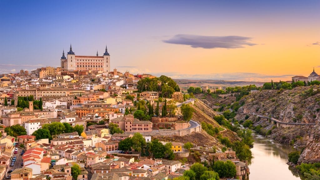 Old town and the Alcázar above the Tagus gorge at sunset, Toledo, Spain