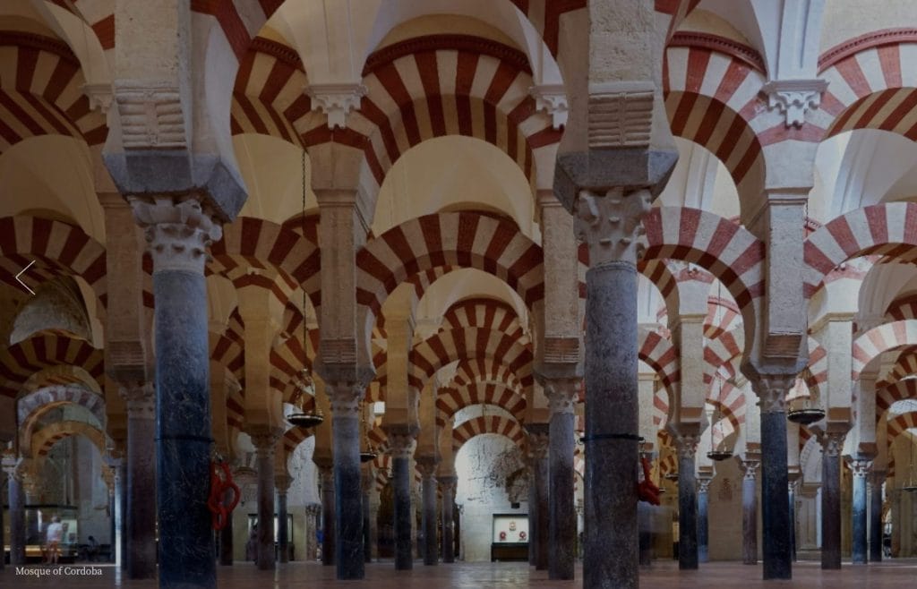 Red and white double arches of the Mezquita prayer hall, Córdoba, Spain