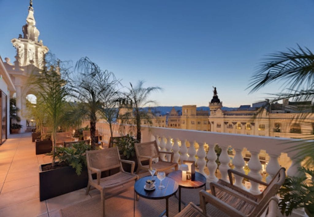 Hotel rooftop terrace above the historic center at dusk, Madrid, Spain