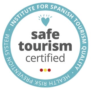 Circular logo stating “safe tourism certified” by the Institute for Spanish Tourism Quality, with a heart icon and “Health Risk Prevention System” text in the border—one of the notable accreditations featured in awards & media mentions for Magical Spain.