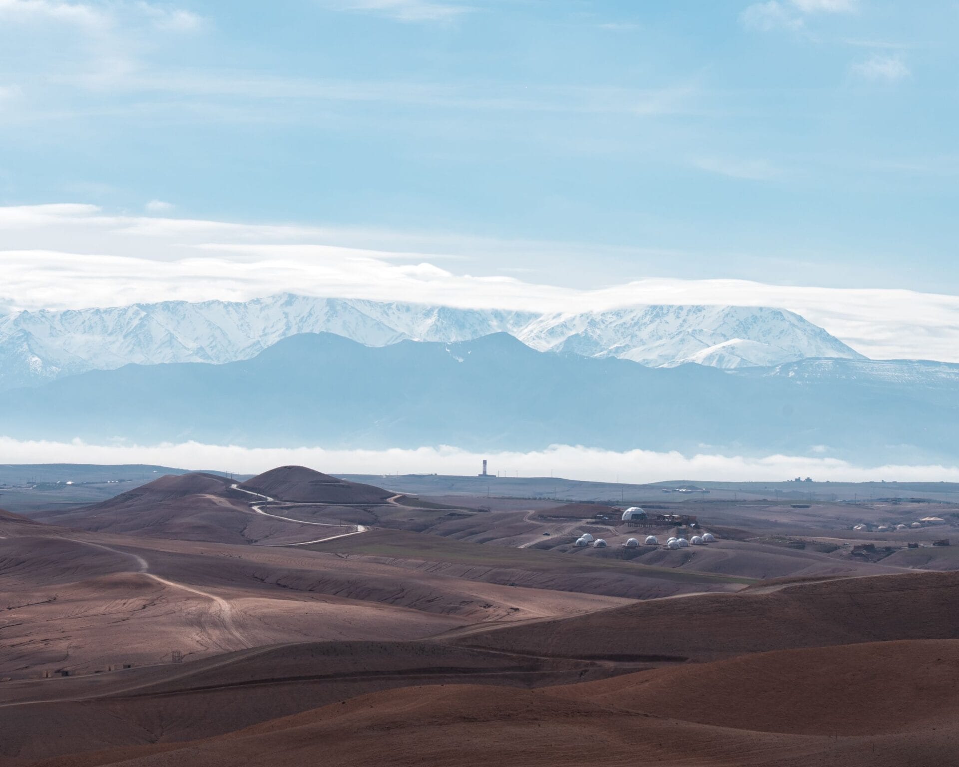 Agafay desert hills with the snowy High Atlas behind, near Marrakech