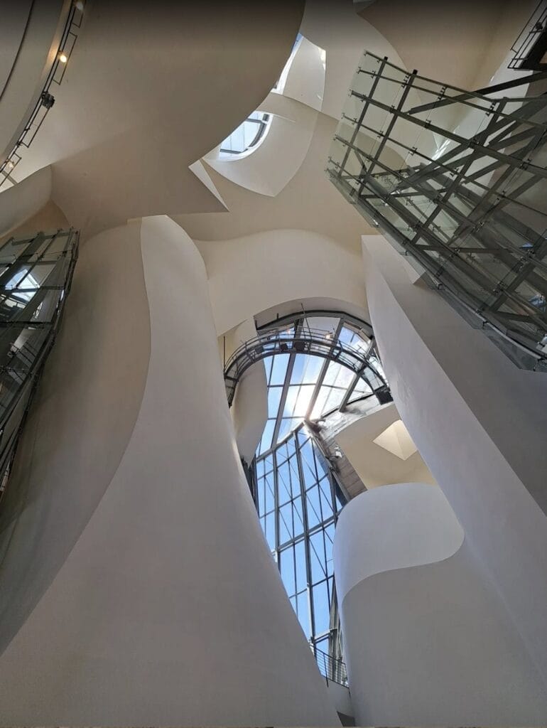 Curving white walls and skylight of the Guggenheim Museum atrium, Bilbao, Spain