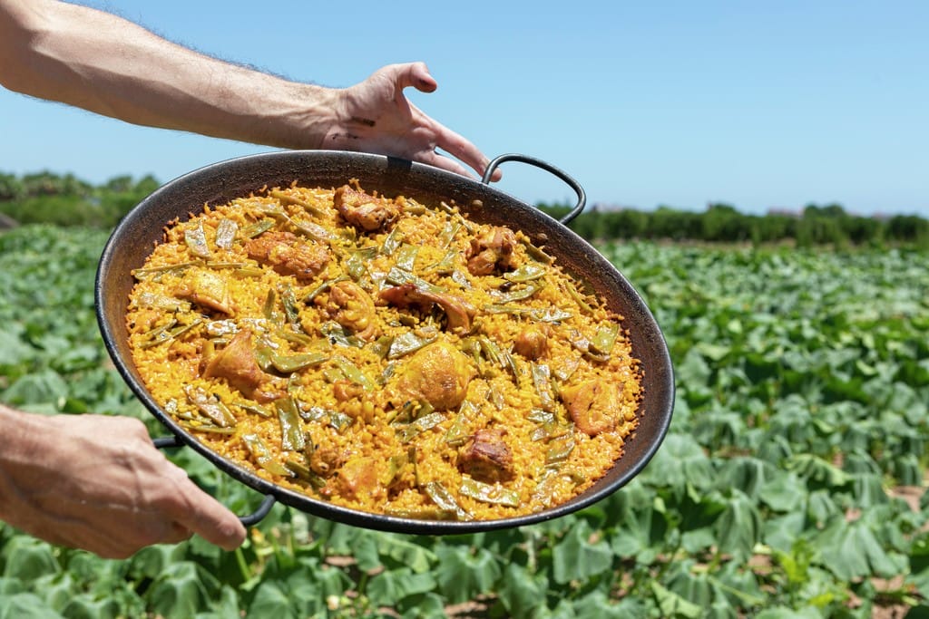 Paella valenciana in the pan, Valencia, Spain