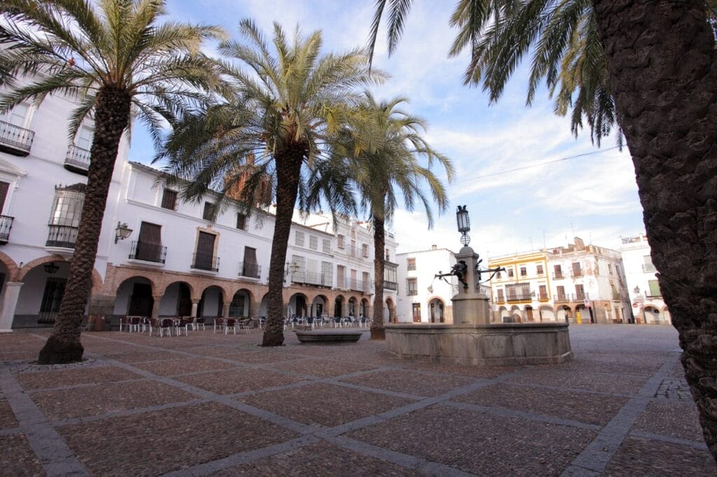 Plaza Grande with its arcades and palm trees, Zafra, Badajoz, Spain